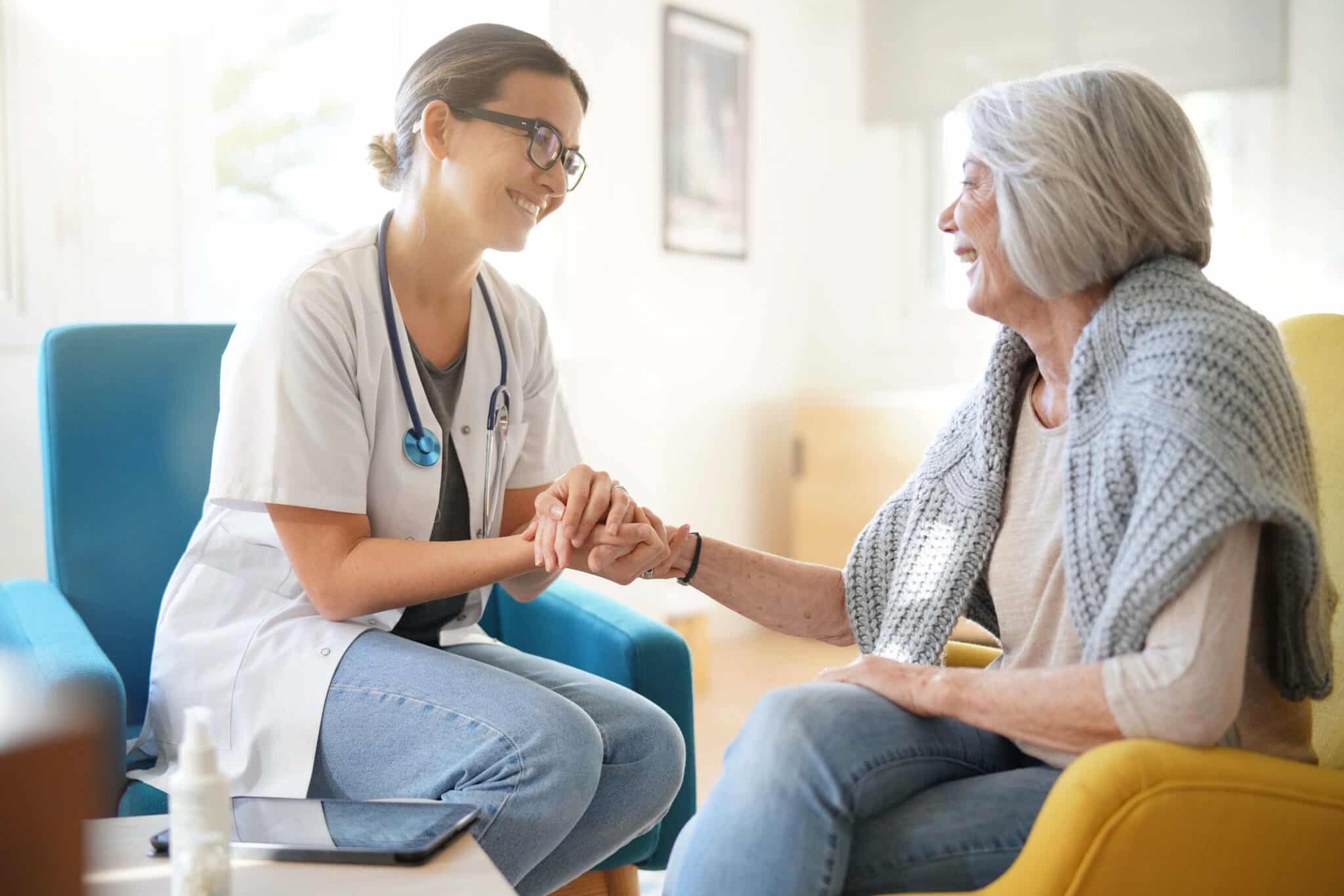 Doctor comforting woman, symbolizing patient-centered care enhanced by CDI and medical transcription.