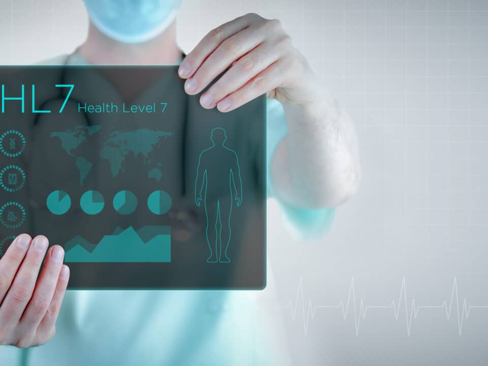 Doctor holds futuristic tablet showing 'HL7' to symbolize advanced clinical documentation technology