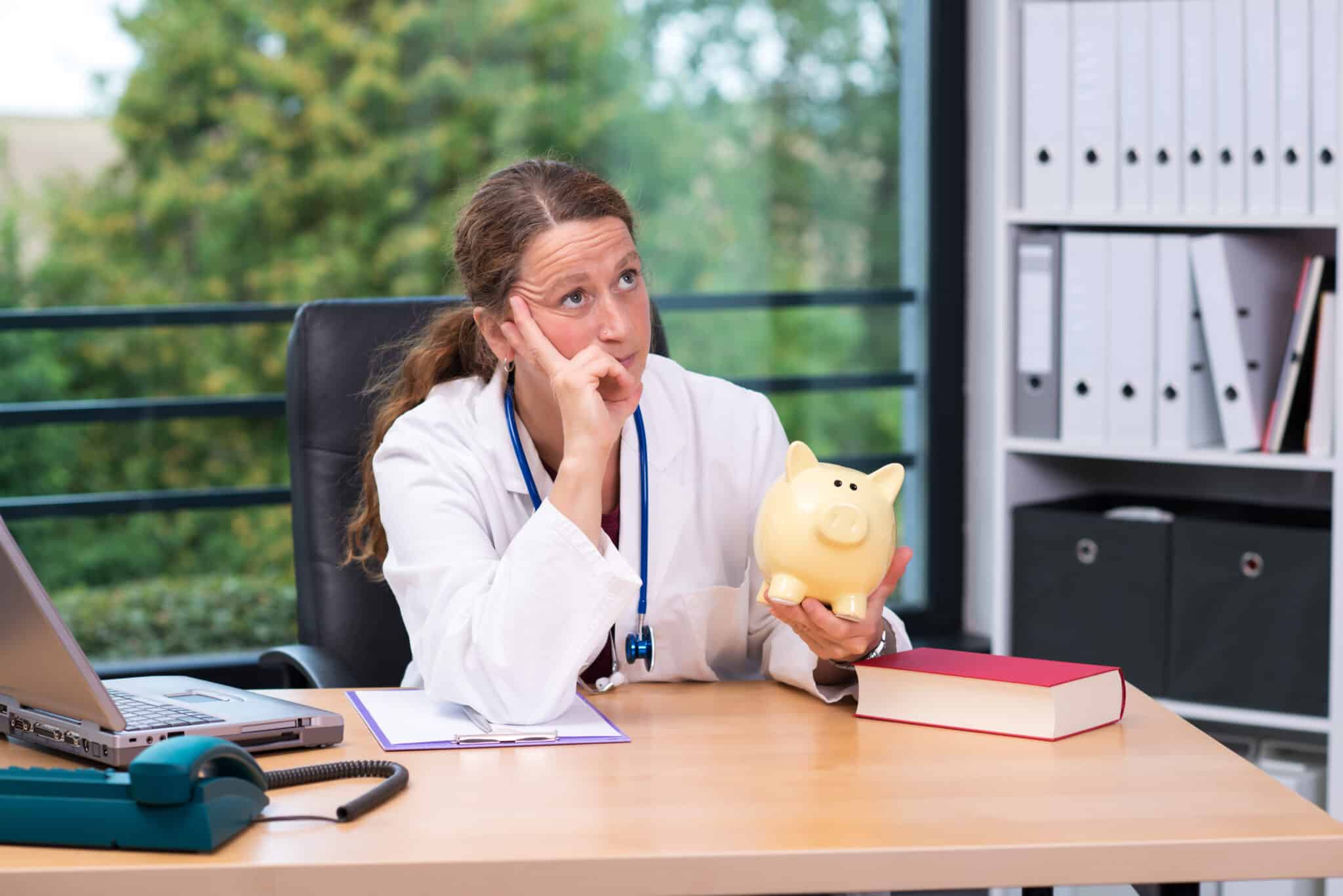 Doctor with piggy bank ponders a productivity boost & more RVUs with medical transcription services.