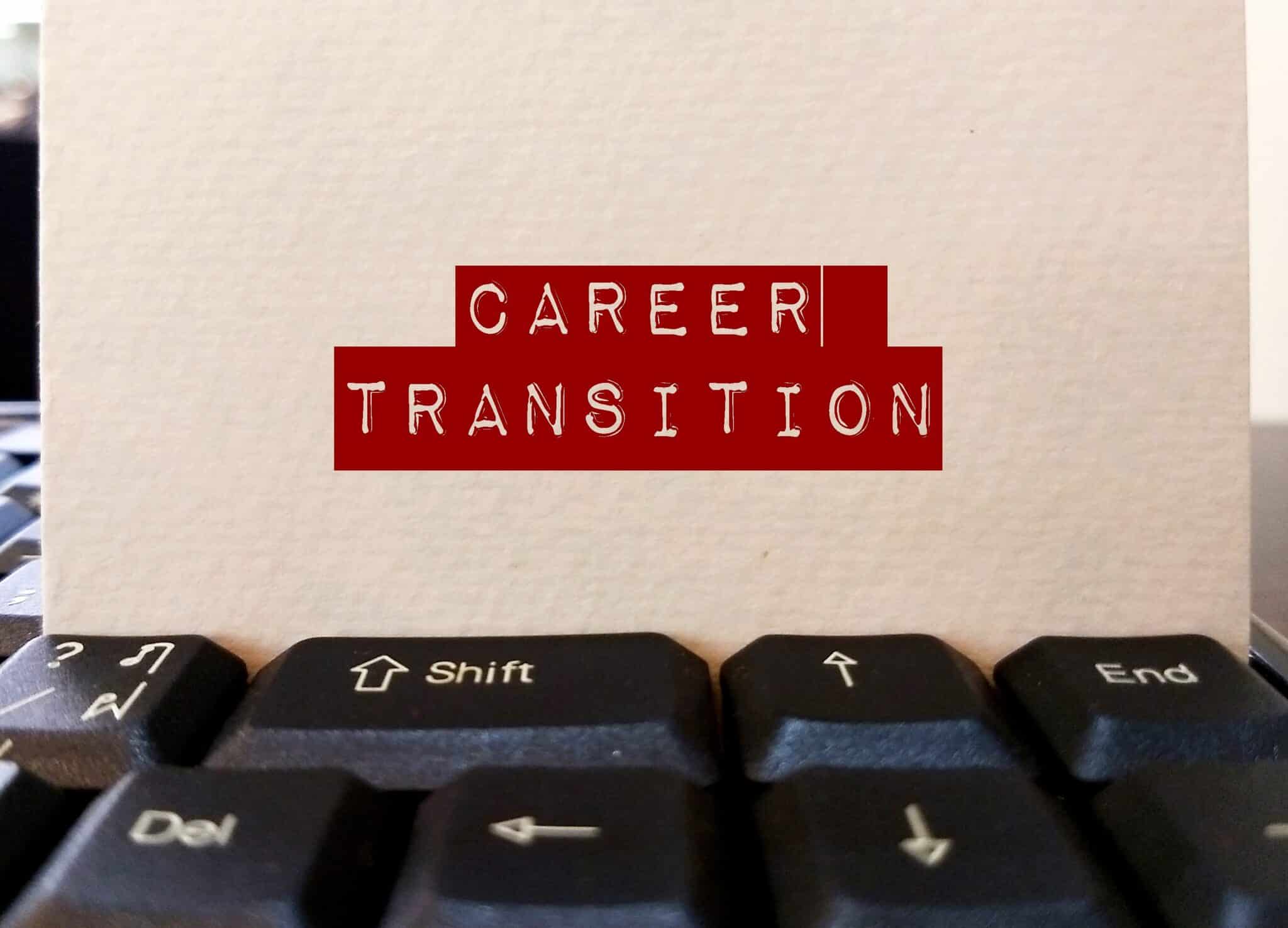 Keyboard with 'CAREER TRANSITION' note indicating a job change ahead for a medical transcriptionist.