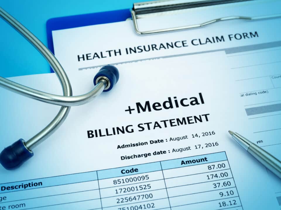 Medical bill and insurance claim form depict healthcare costs; medical transcription plays a role.