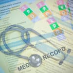 Stethoscope, ICD-10 codes and patient records, symbolizing healthcare diagnostics and documentation.