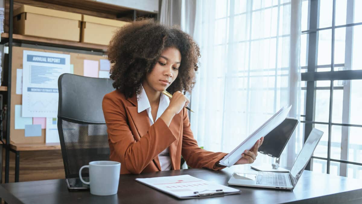 Auditor performing a financial audit, showcasing the importance of finance transcription services.