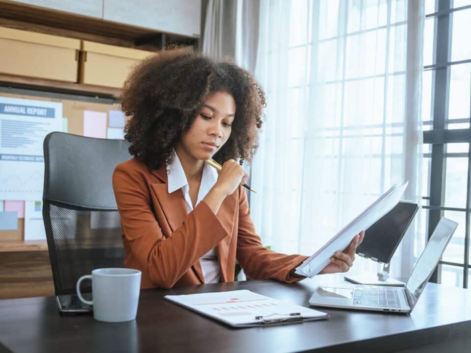 Auditor performing a financial audit, showcasing the importance of finance transcription services.