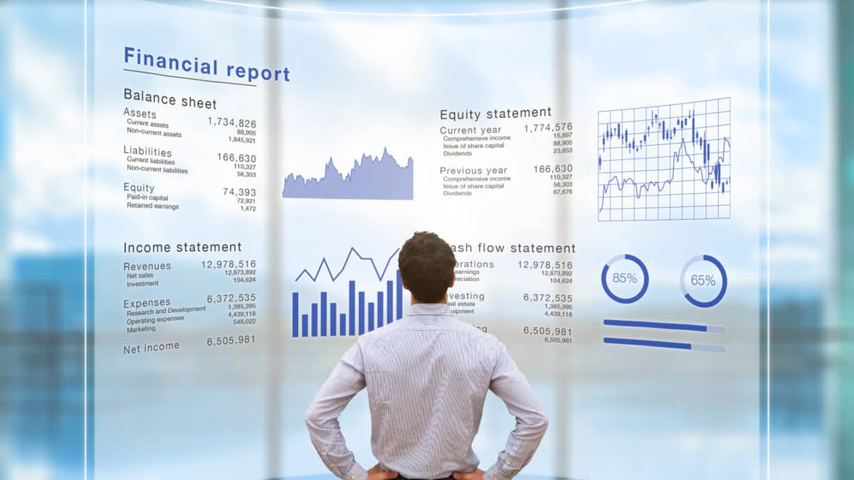 Businessman examining financial report, symbolizing the role of finance transcription in fintech