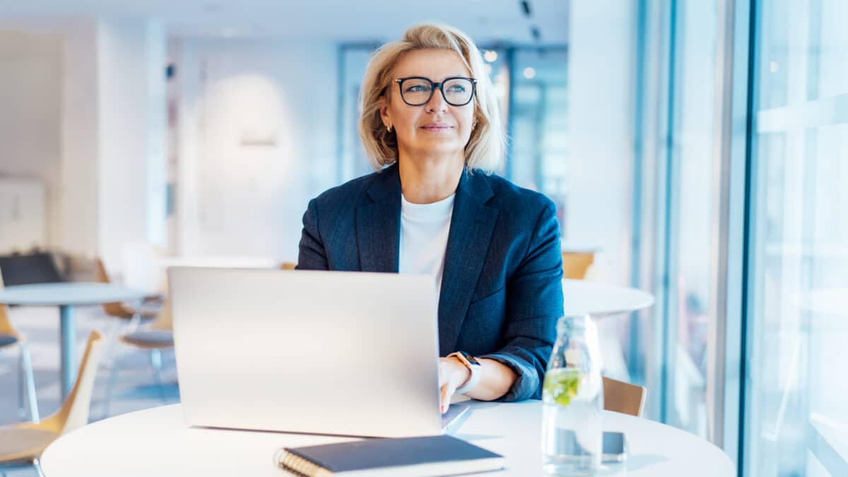 Businesswoman in office, reflective of seasoned finance professionals using Athreon's transcription