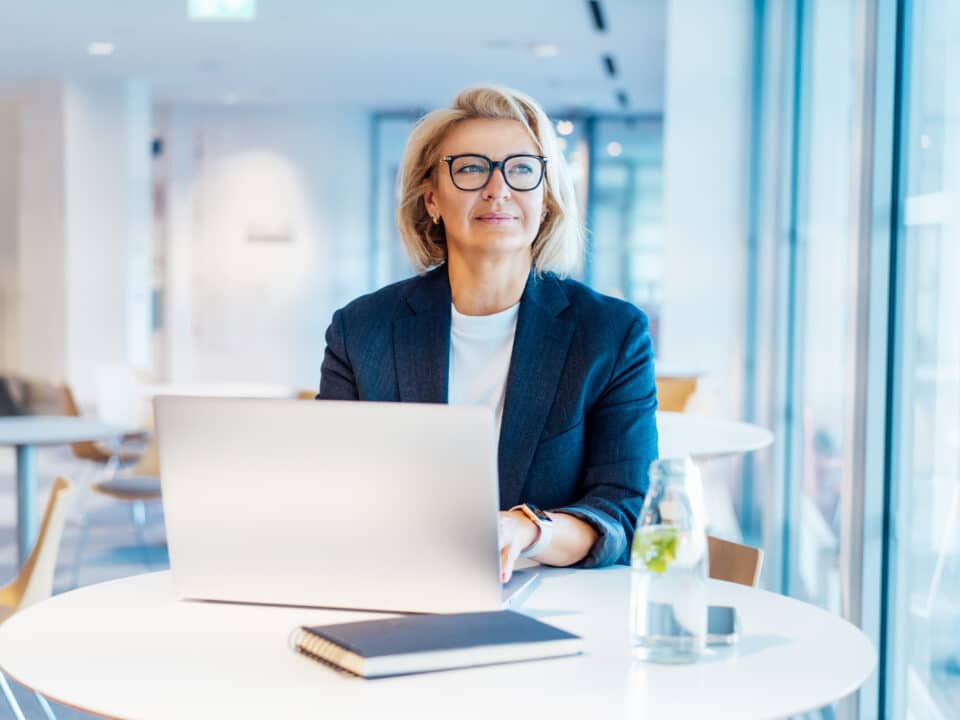 Businesswoman in office, reflective of seasoned finance professionals using Athreon's transcription