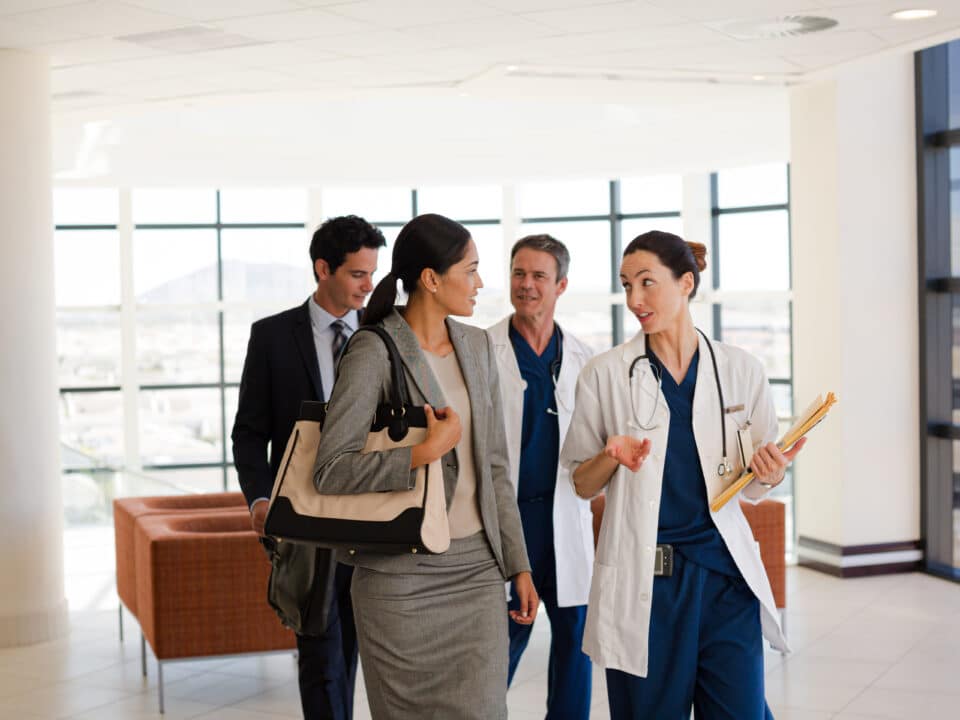 Executive staff and physicians discussing various clinical documentation options for their facility.