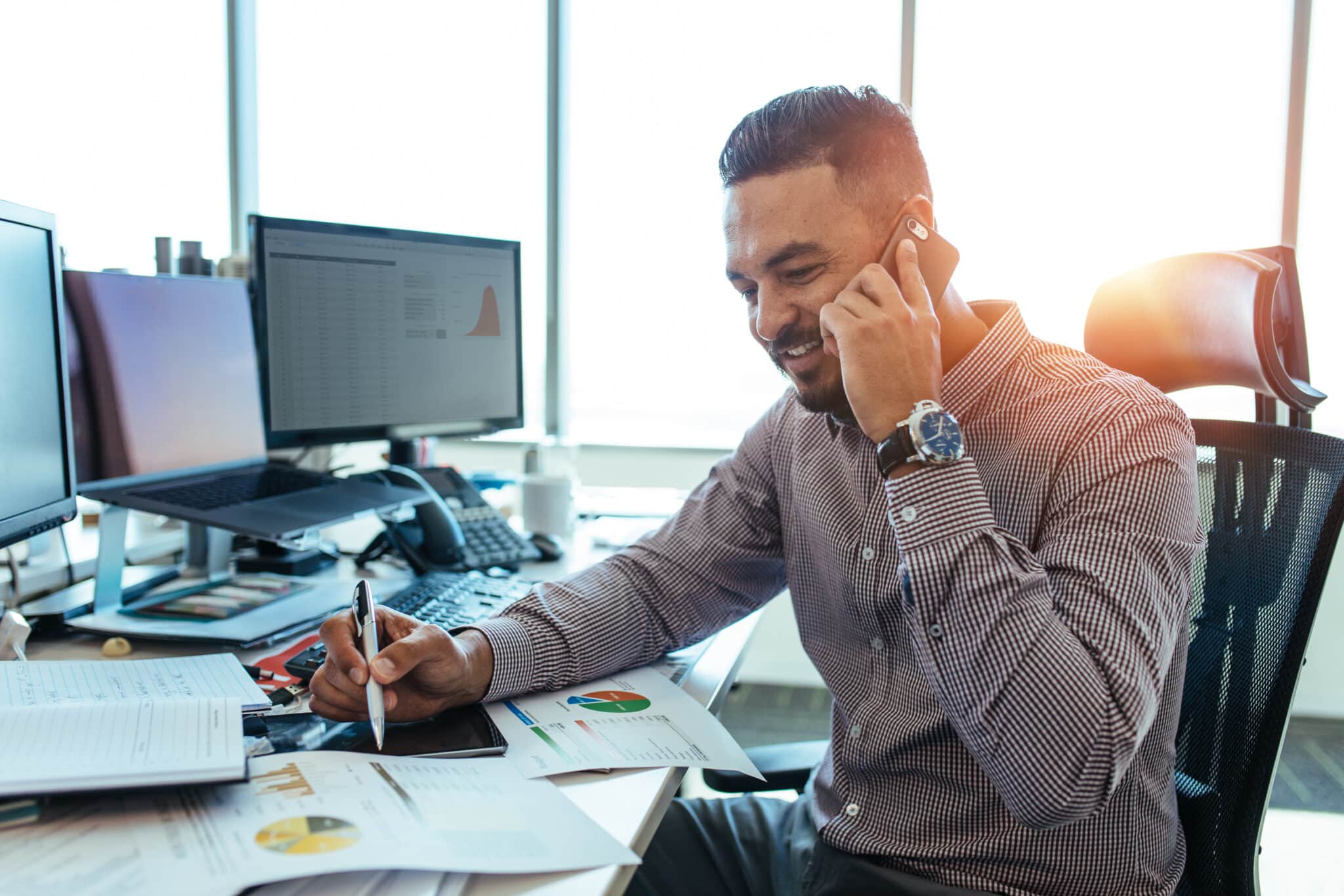 Manager has critical phone conversation, showcasing the importance of finance transcription.