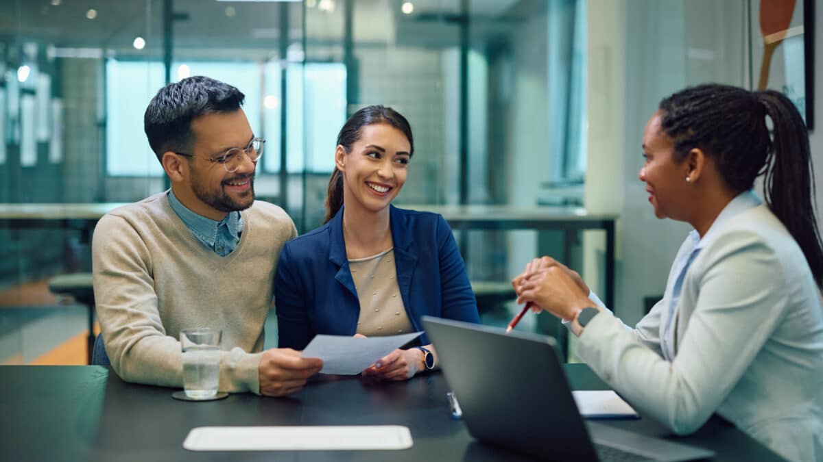 A couple discusses agreement with a bank manager, an instance where transcription services can help.