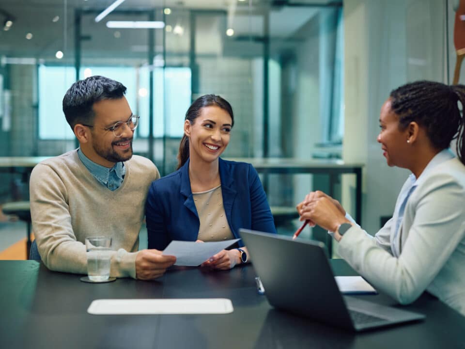 A couple discusses agreement with a bank manager, an instance where transcription services can help.