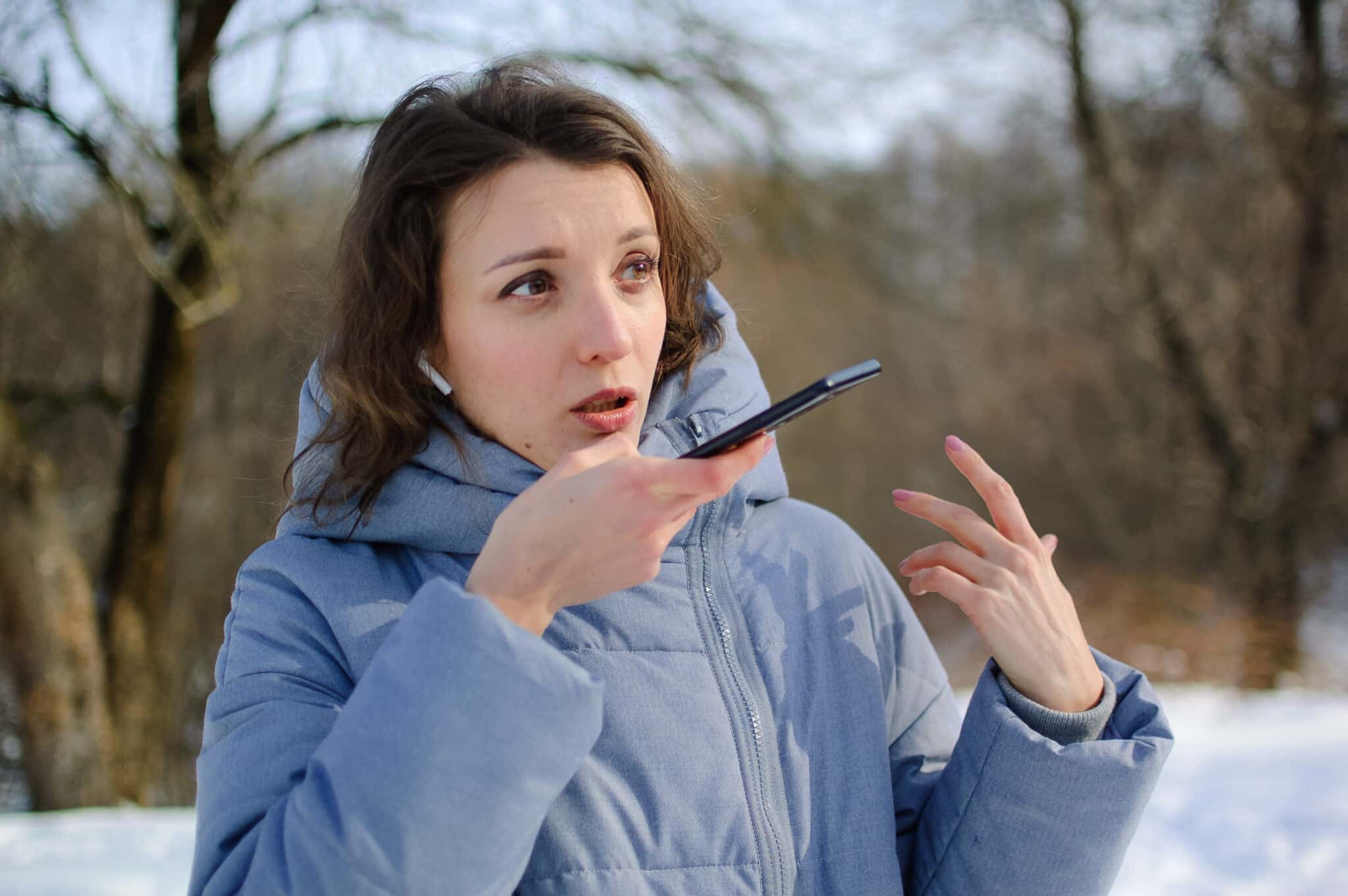 Insurance adjuster dictates into her iPhone for field note transcription, boosting her productivity.