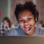 Insurance call center agent works on a support hotline. Her conversation will be transcribed.