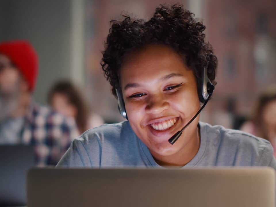 Insurance call center agent works on a support hotline. Her conversation will be transcribed.