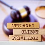 Blocks spell 'Attorney-Client Privilege', highlighting Athreon's secure transcription compliance.