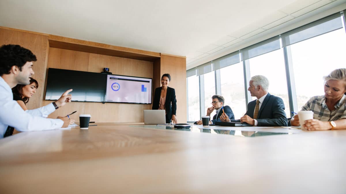 Board members in a board meeting, exemplifying the critical role of Athreon's transcription service.