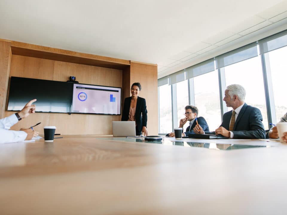 Board members in a board meeting, exemplifying the critical role of Athreon's transcription service.