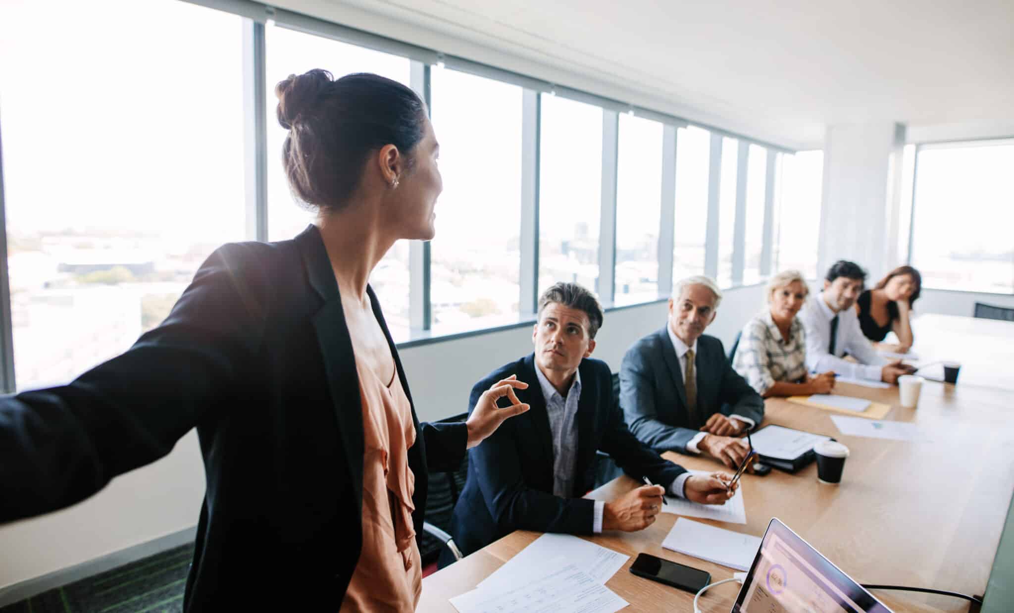 Businesswoman records a training meeting, demonstrating the role of Athreon's transcription service.