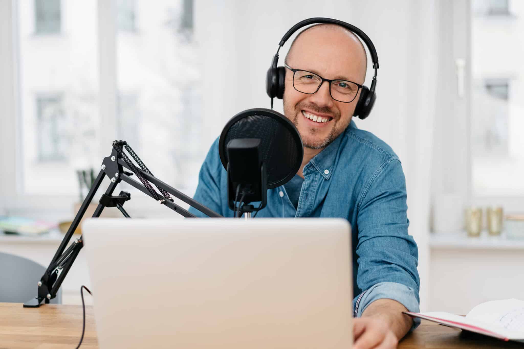 Male podcaster is visibly pleased with Athreon's professional services for his podcast transcripts.