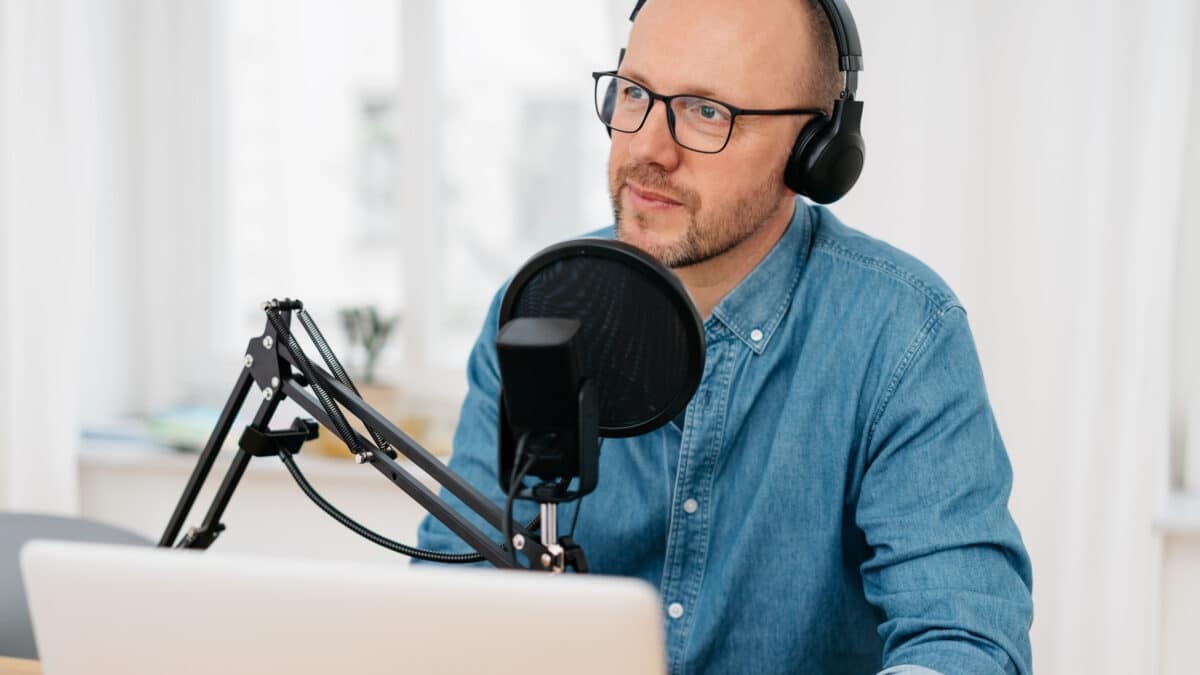 Man considers options among DIY, AI, and professional transcription services for his podcast.
