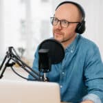 Man considers options among DIY, AI, and professional transcription services for his podcast.