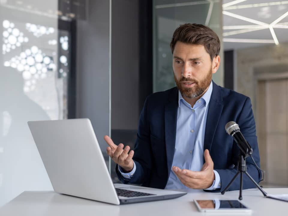 CEO uses a microphone and laptop to record a private podcast; uses secure transcription services.